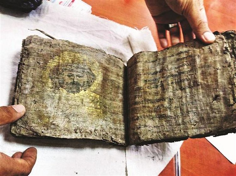 The ancient gilded Bible is nearly a millenia old according to officials. DHA Photo