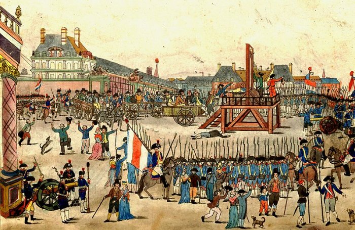 The execution of Robespierre and his supporters on 28 July 1794. Note: the beheaded man (6) is not Robespierre, but Couthon: Maximilien Robespierre (10) is shown sitting on the cart, dressed in brown, wearing a hat, and holding a handkerchief to his mouth. His younger brother Augustin (8) is being led up the steps to the scaffold.