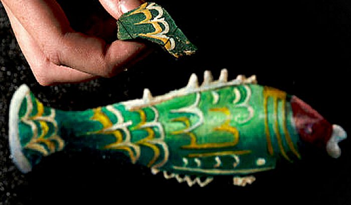 The fragment above an artist’s impression of how the fish bottle would have looked. Photograph: National Trust/Rod Kirkpatrick/F Stop Press