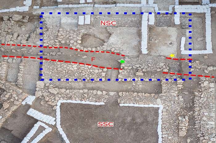 Aerial view showing the Southern Storage Complex (SSC), the Northern Storage Complex (NSC; blue dashed box) and the trench (red dashed lines) Credit: Eric Cline/GW