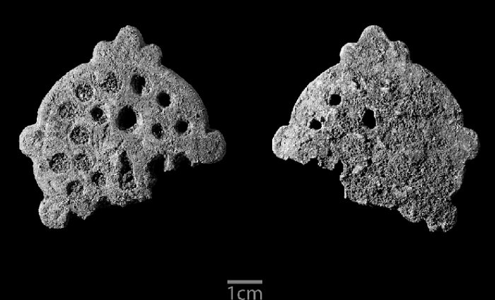 Decorated brass artefact from Unguja Ukuu, Zanzibar (Photo: Ian Cartwright, University of Oxford).