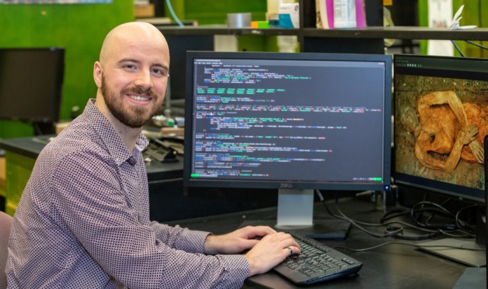 George Long, a graduate student of bioinformatics at McMaster, is the lead author of a study that identified and reconstructed the first ancient genome of E. coli using fragments extracted from the gallstone of a 16th century mummy. (Photo by Georgia Kirkos/McMaster University)