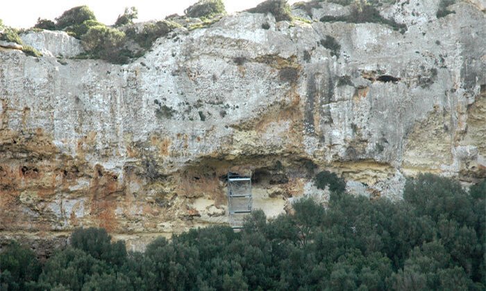 La Cova des Pas, near the town of Ferreries, is a prehistoric mass burial site with the largest collection of complete human skeletons found in Menorca. Credit: GREAB-UAB