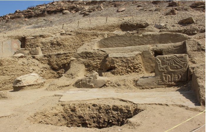 Pre-Inca Temple With Colored Paintings And Carved Sculptures Discovered At The Los Paredones Archaeological Complex, Peru